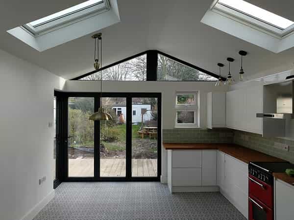 an image of a new and modern kitchen and a new bifolding door extention